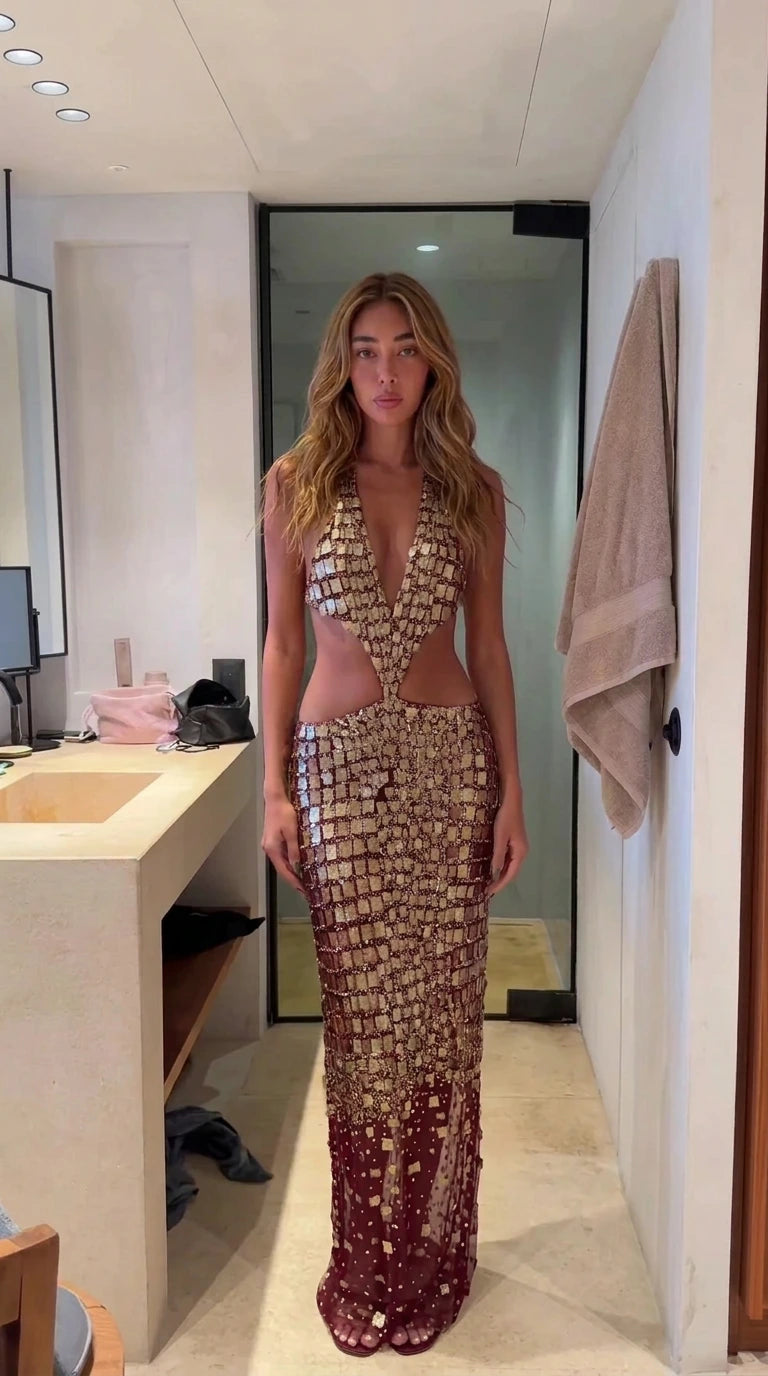 Model wearing burgundy wine sequin cutout halter evening maxi dress