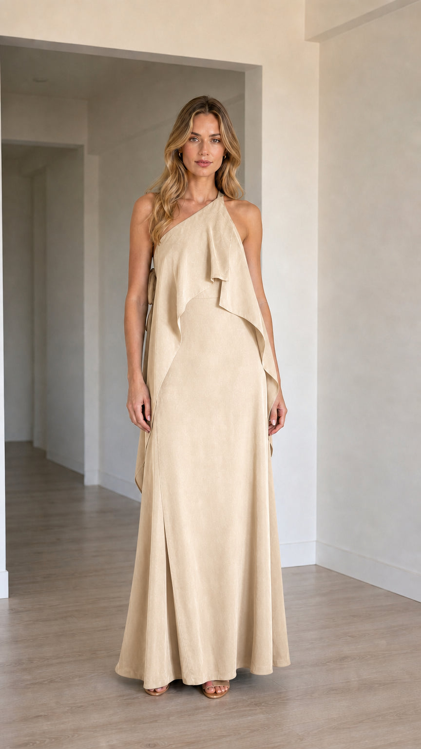 Front view of model wearing the one-shoulder cascading ruffle maxi dress in champagne beige