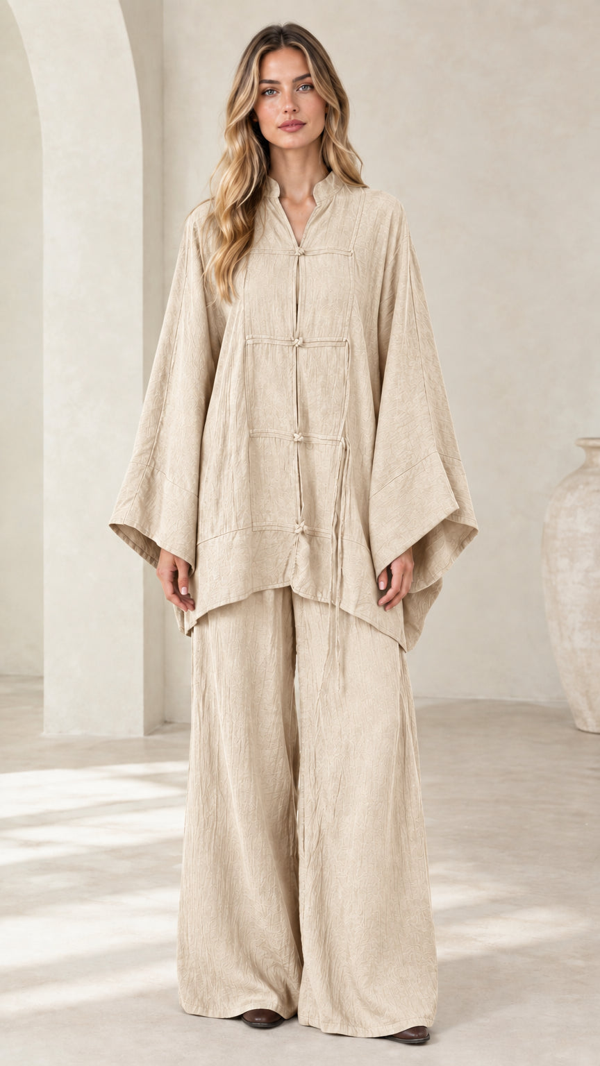 Front view of women's beige oatmeal frog button tunic and wide leg pant set