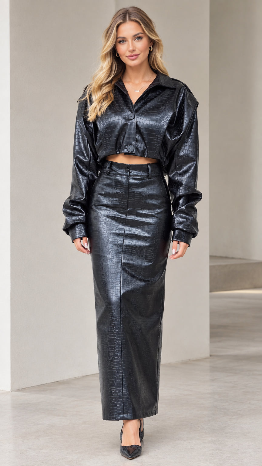 Front view of model wearing black crocodile embossed faux leather cropped jacket and maxi skirt set