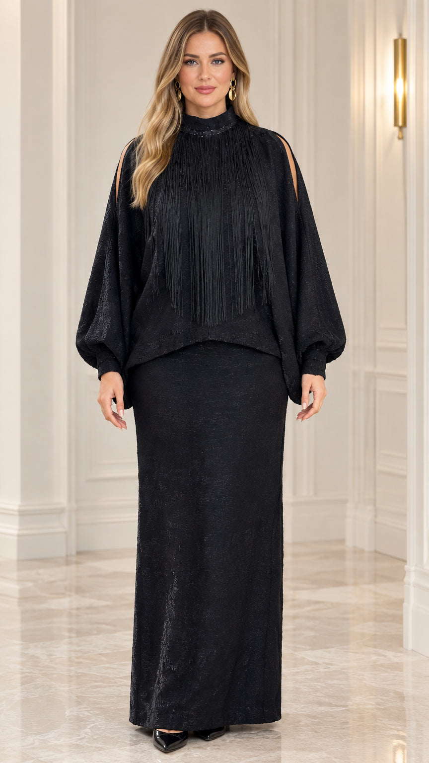 Front view of model wearing black fringe mock neck two-piece maxi dress set