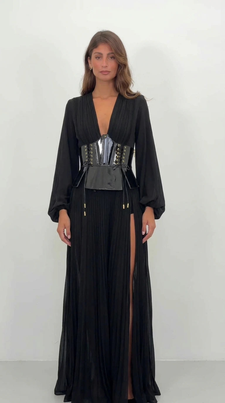 Front view of black pleated deep V-neck corset maxi dress with high slit