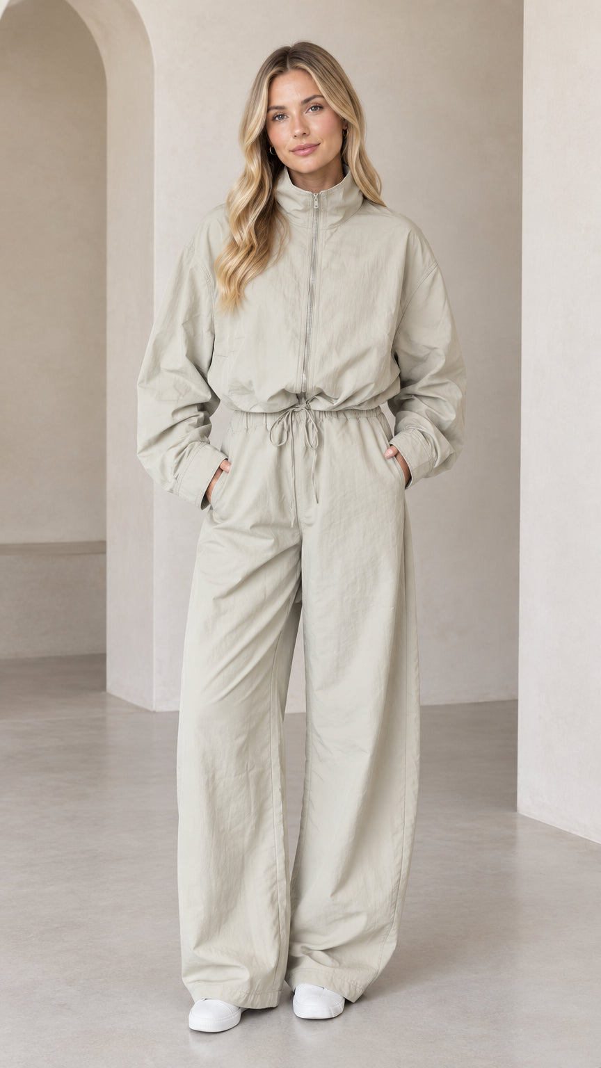 Front full-length view of woman wearing Light Sage zip-up wide-leg utility jumpsuit