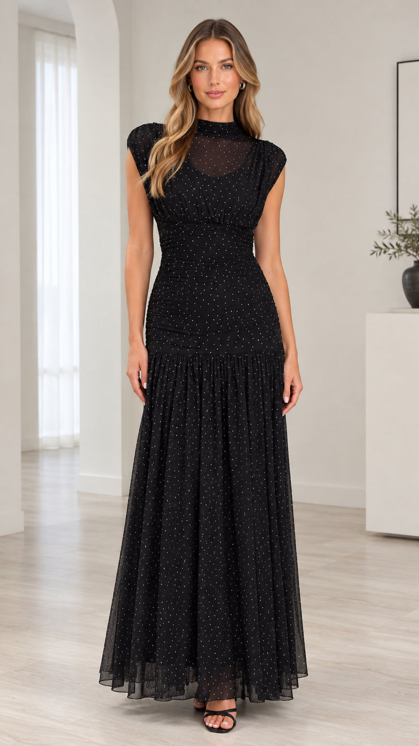 Front full-length view of model wearing black sparkle mesh mock neck ruched maxi dress