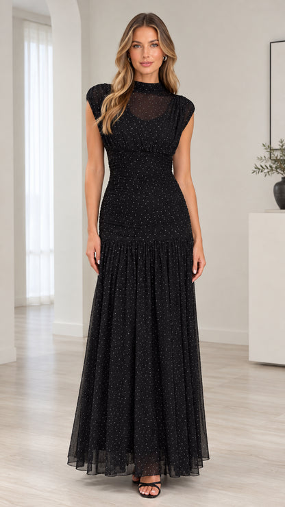 Front full-length view of model wearing black sparkle mesh mock neck ruched maxi dress