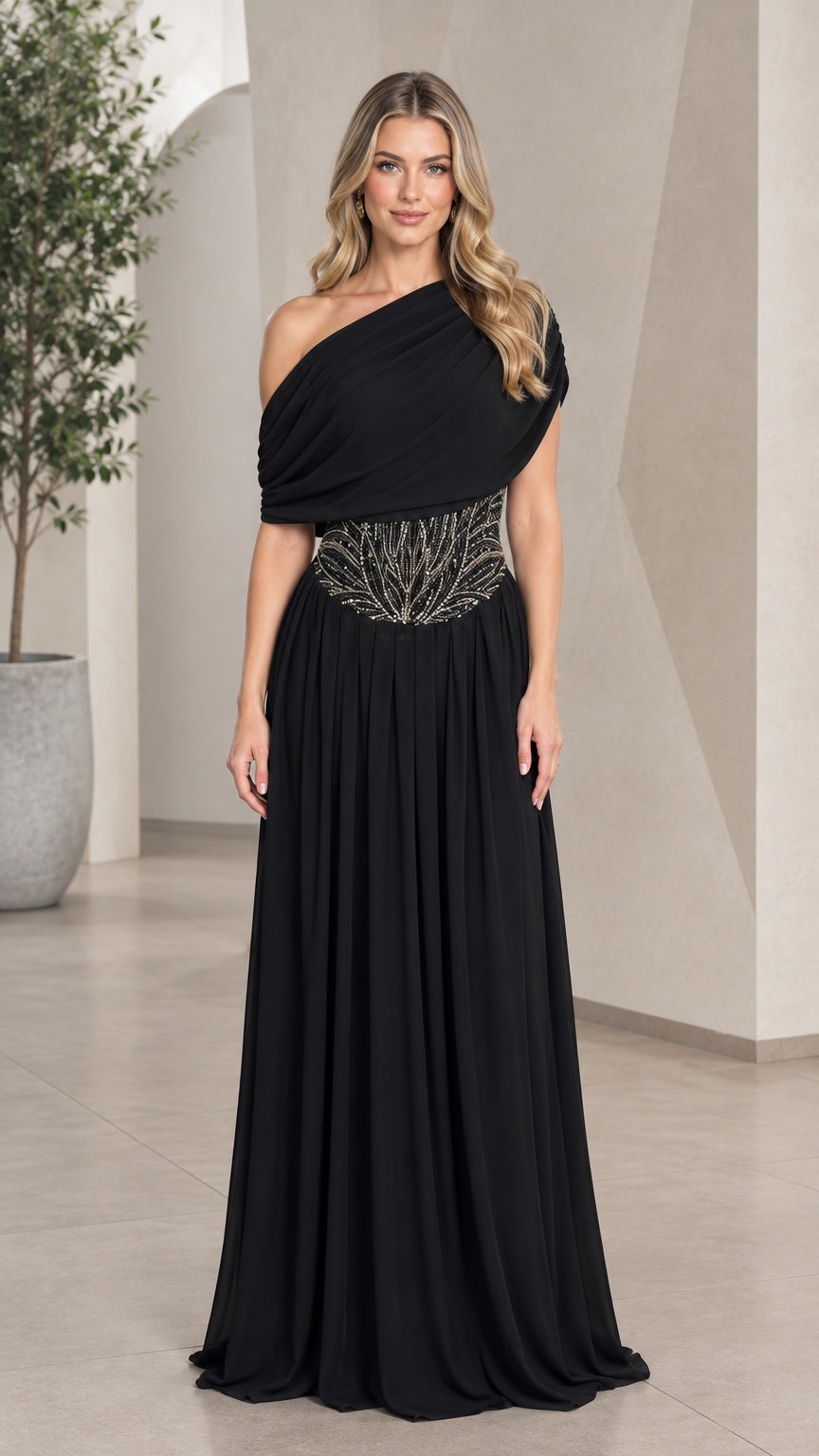 Front view of model wearing a black one-shoulder pleated chiffon evening gown with beaded waist