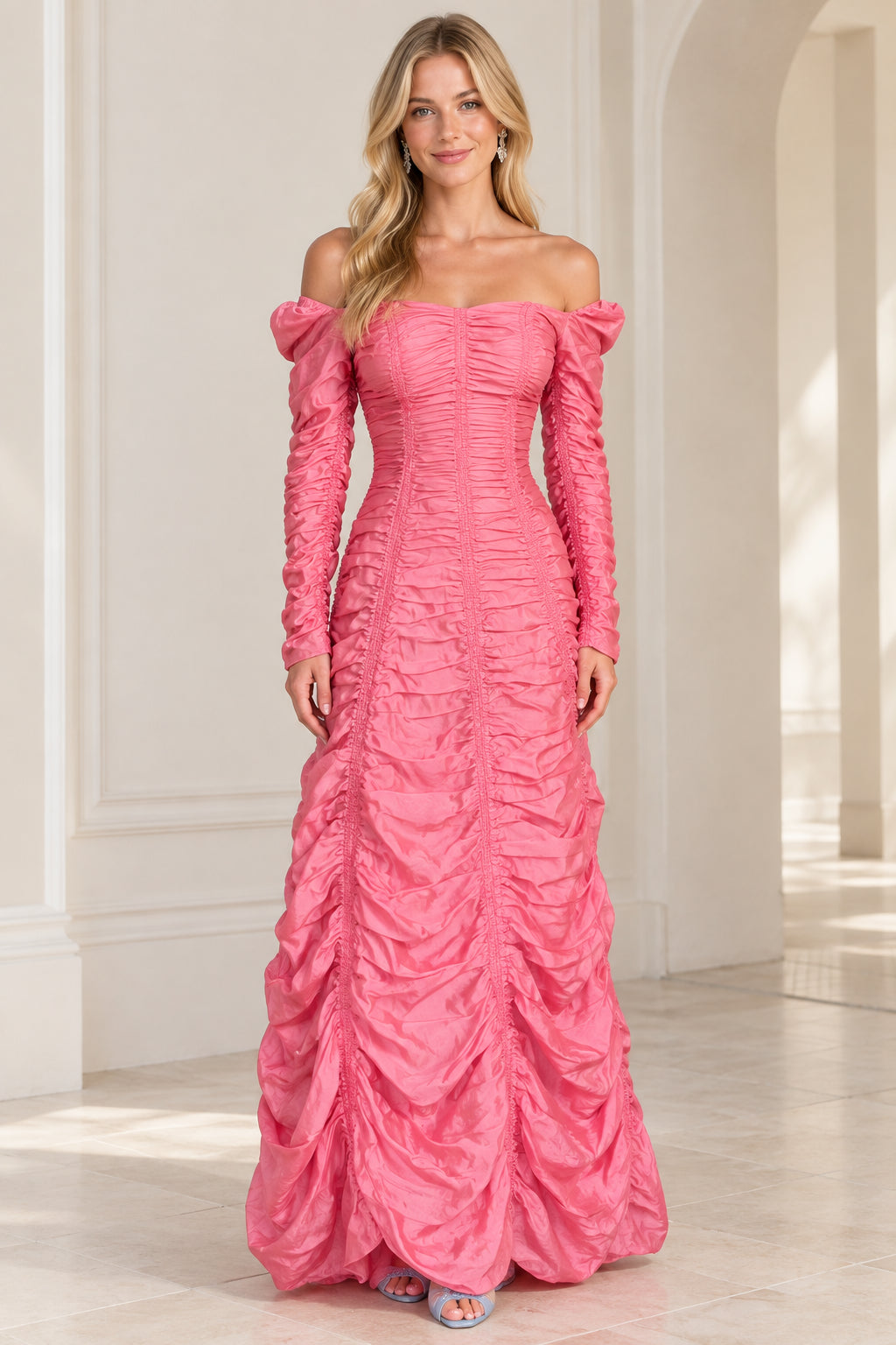 Front view of woman wearing pink off-the-shoulder ruched long sleeve evening maxi gown