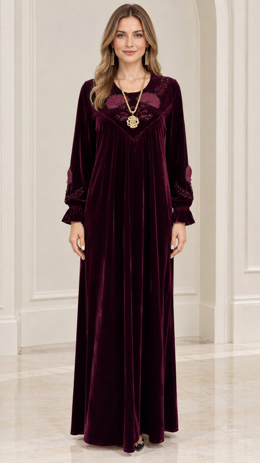 Front full view of burgundy embroidered velvet maxi kaftan dress on model