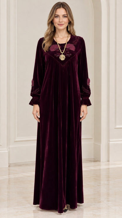 Front full view of burgundy embroidered velvet maxi kaftan dress on model