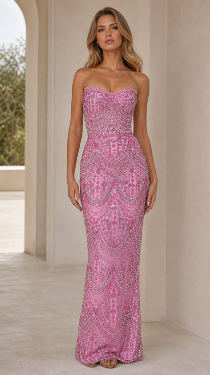 Front view of model wearing pink strapless beaded sweetheart maxi evening gown