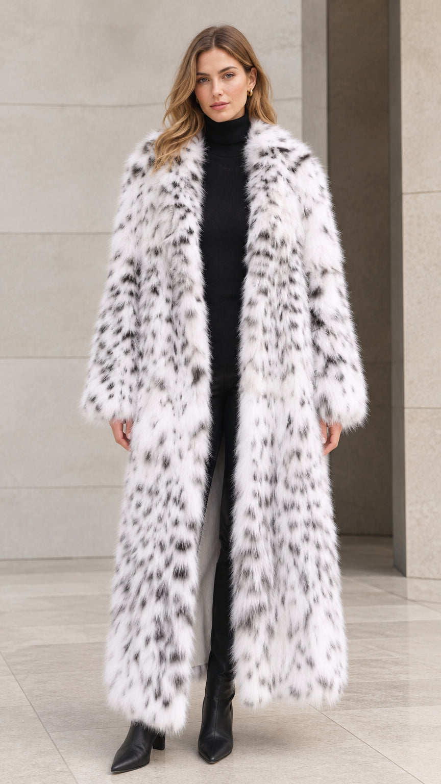 Front full view of woman wearing full-length white speckled faux fur maxi coat with black turtleneck and boots