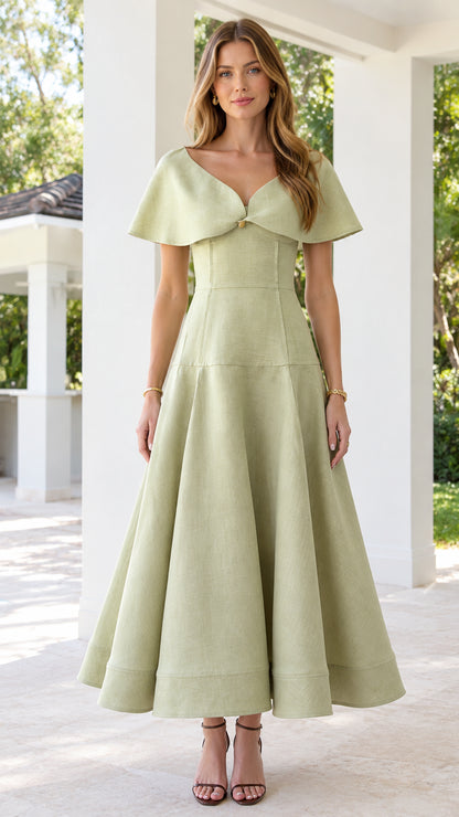 Front view of woman wearing sage green capelet V-neck A-line midi dress