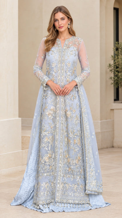 Front view of model wearing a light blue embroidered long sleeve formal evening gown with beaded hem