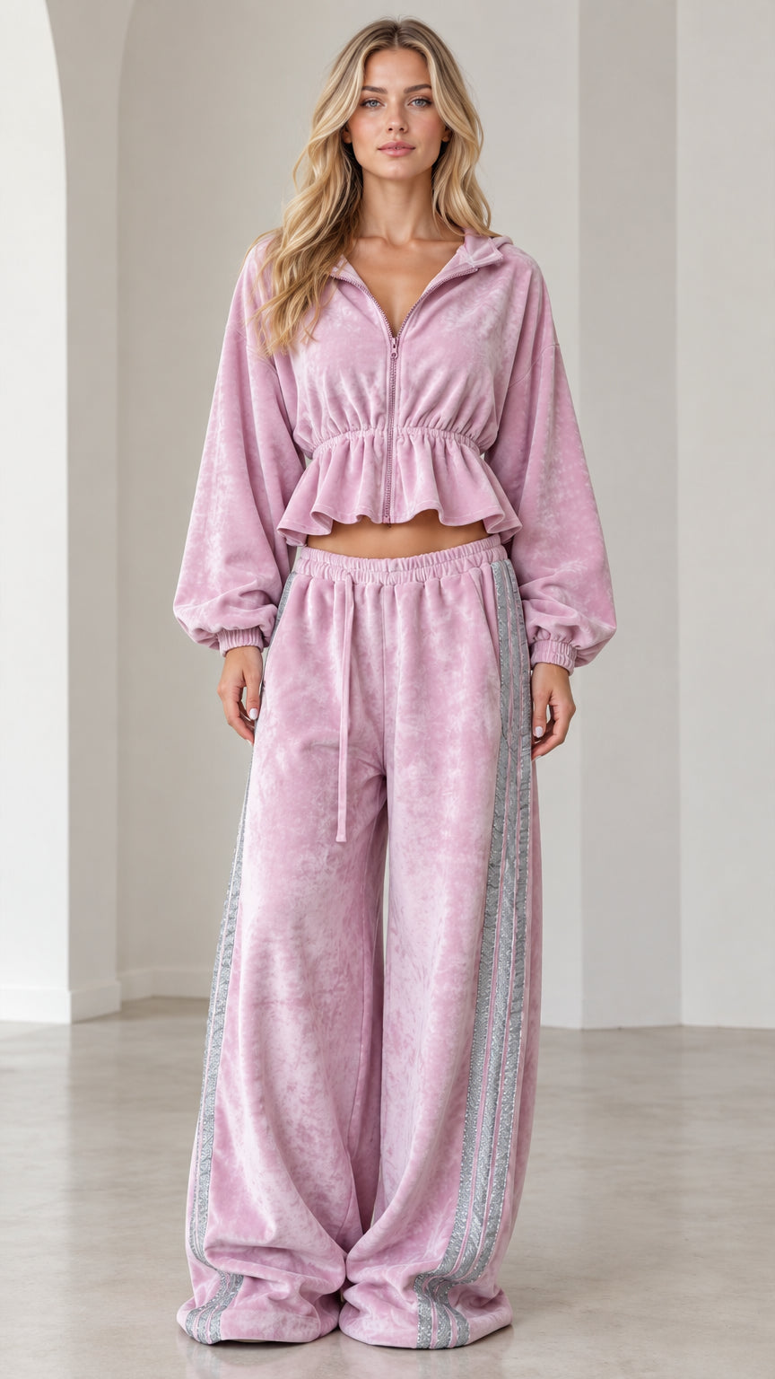 Front full-length view of model wearing lilac pink velour cropped ruffle tracksuit set with wide-leg pants