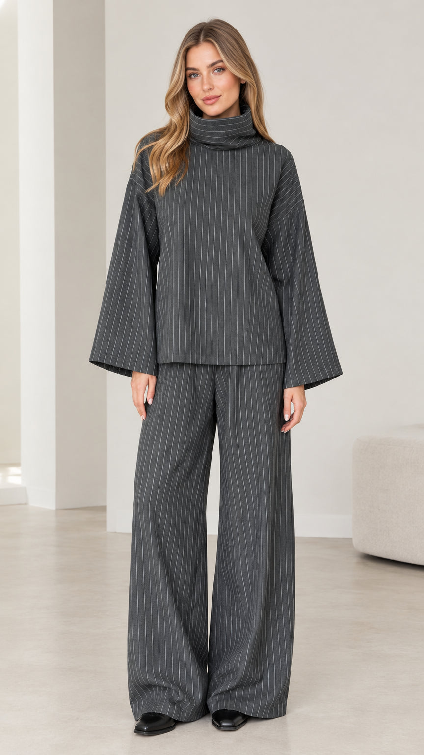 Front view of woman wearing Charcoal Grey pinstripe turtleneck top and wide-leg pants set