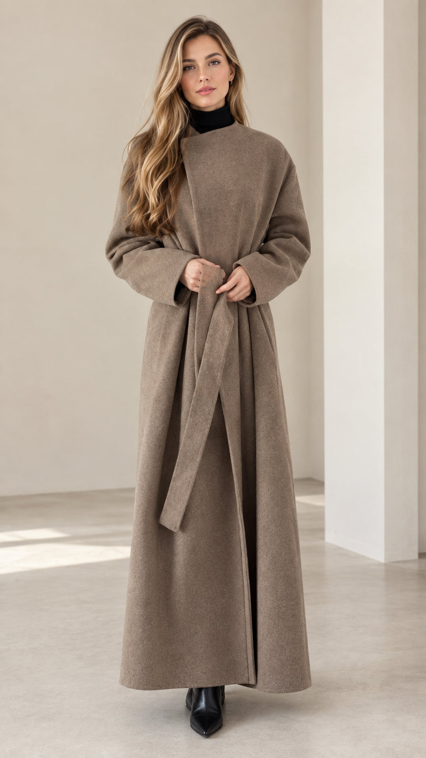 Front view of model wearing taupe maxi wrap coat with waist belt