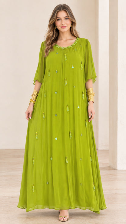 Front full-length view of model wearing lime green pleated chiffon maxi dress with beaded details