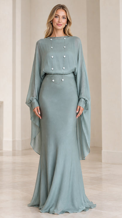 Front view of model wearing sage green draped cape-sleeve maxi evening dress