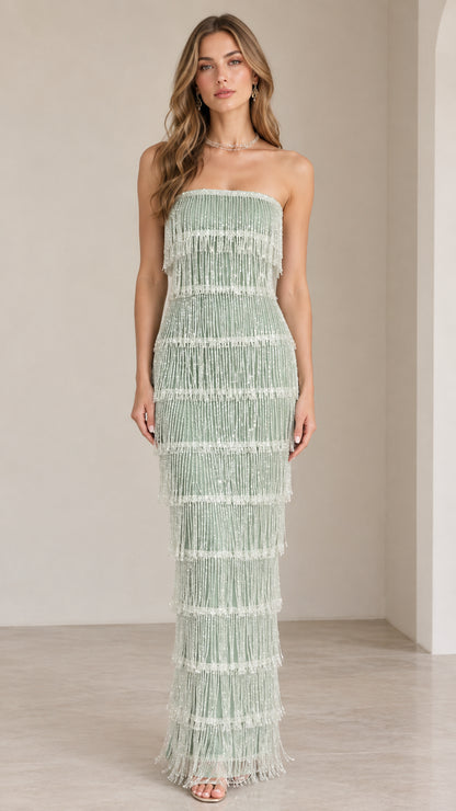 Front view of model wearing sage green strapless tiered beaded fringe maxi gown