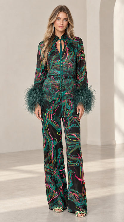 Front full-length view of model wearing Emerald Black feather cuff printed satin pant set