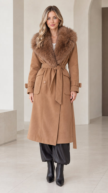 Front view of model wearing camel long coat with faux fur shawl collar and tie belt