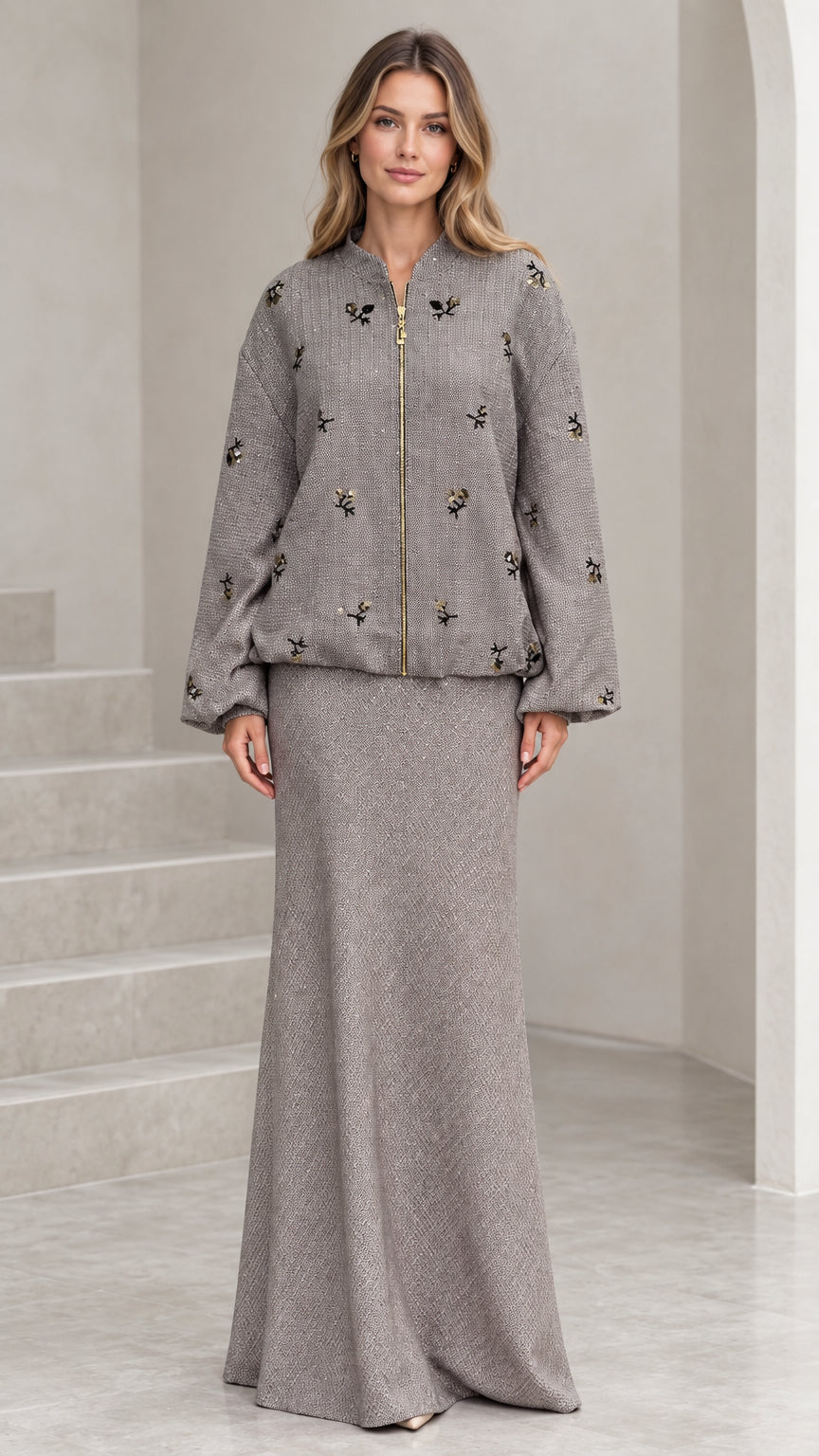 Front full view of grey beaded tweed bomber jacket and matching maxi skirt set