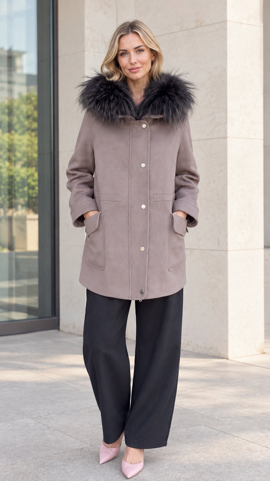 Front full-length view of model wearing taupe faux fur hooded parka coat with black wide-leg trousers