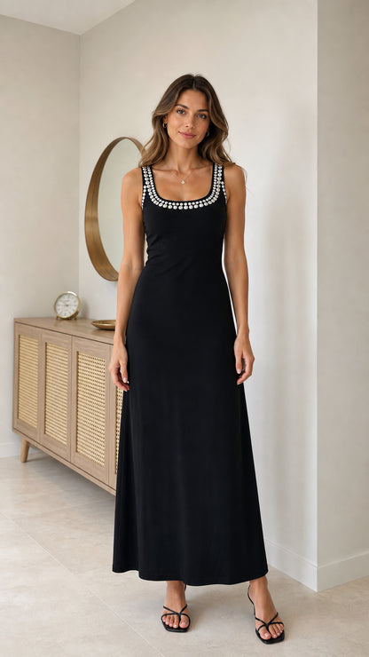 Full front view of model wearing black sleeveless rhinestone trim scoop neck maxi dress