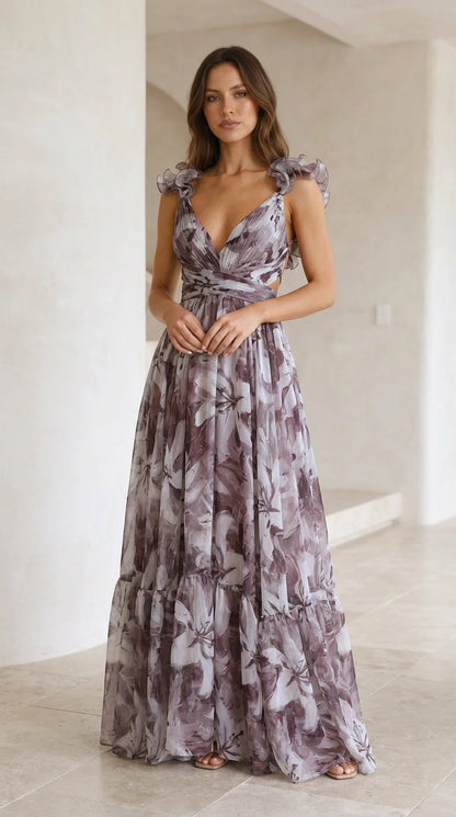 Front view of woman wearing dusty purple floral maxi dress with ruffle straps and tiered skirt