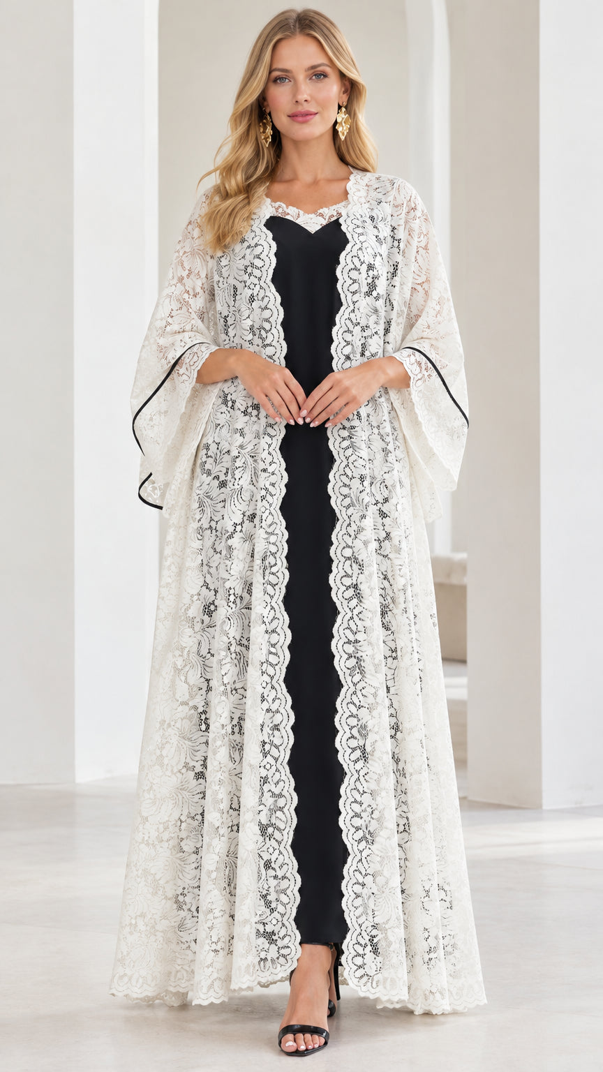 Front full view of white floral lace duster cardigan over black maxi slip dress