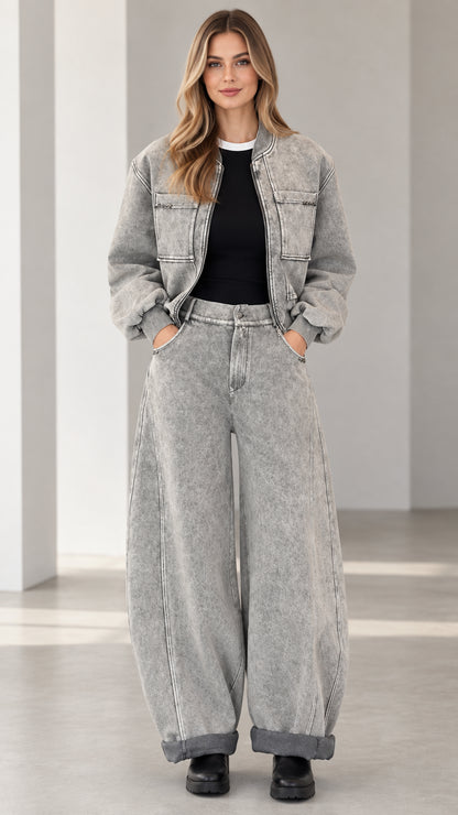 Full front view of model wearing grey acid wash denim bomber jacket and wide leg pants set