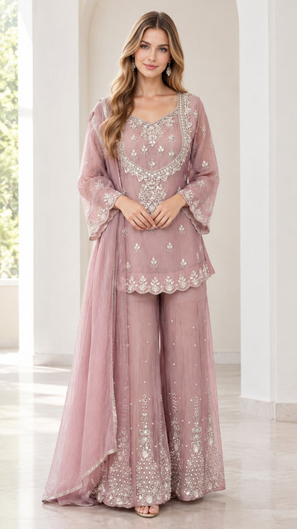Full front view of women's embroidered dusty rose sharara suit set with flared pants and dupatta