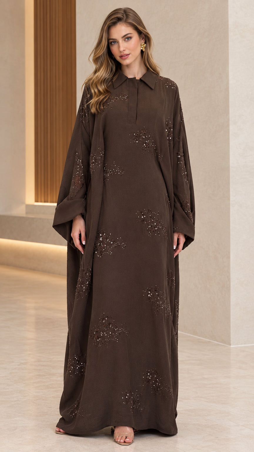Front full-length view of woman wearing brown collared sequin embellished abaya maxi dress
