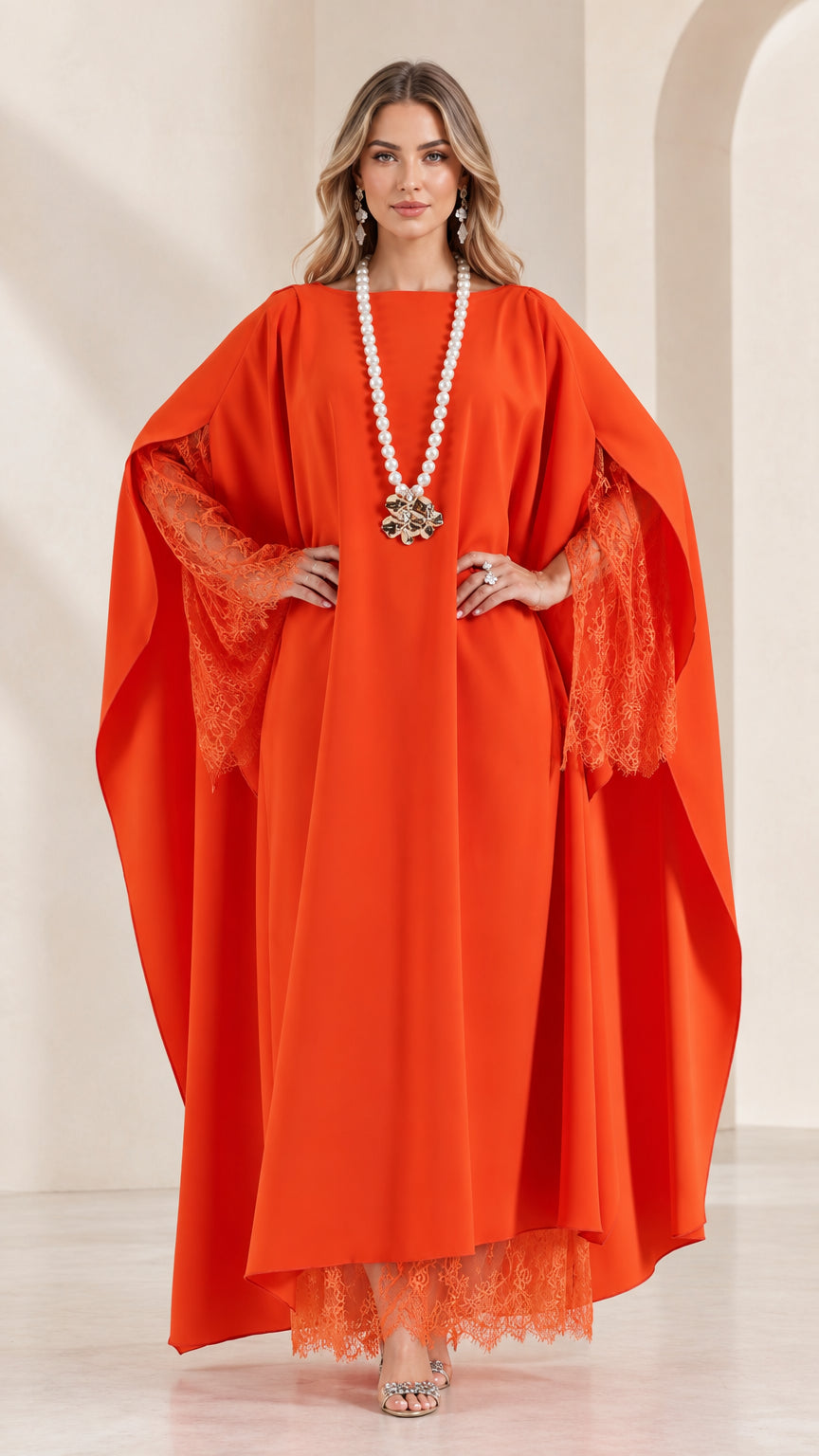 Front view of woman wearing orange cape sleeve kaftan maxi dress with lace trim