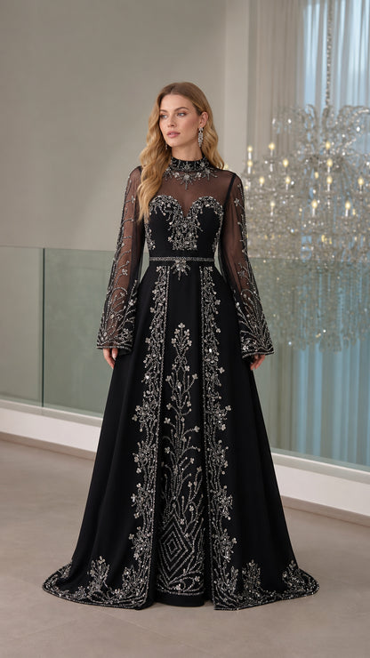 Full front view of the long sleeve black evening gown with silver rhinestone embroidery and illusion neckline