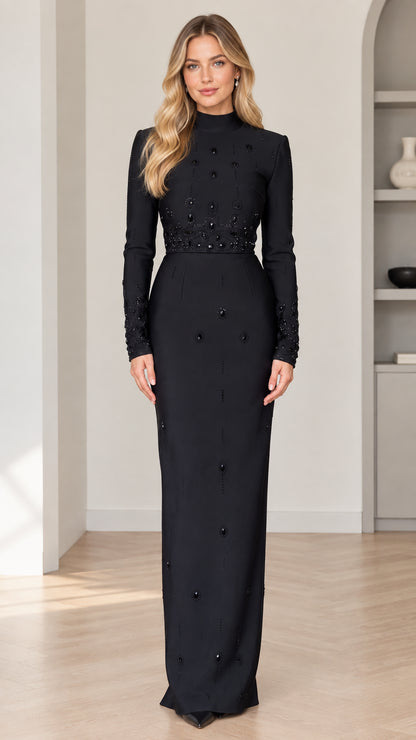 Front view of model wearing black mock neck long sleeve beaded maxi evening dress