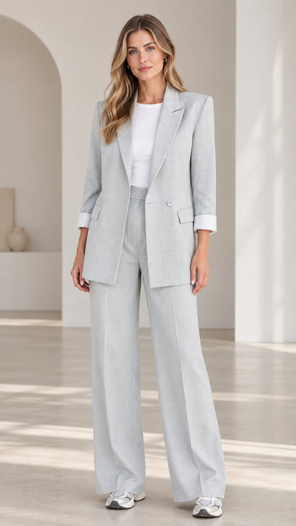Front full-length view of woman wearing Light Grey two-piece blazer and wide-leg trousers suit set