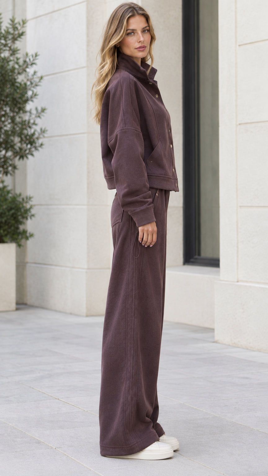 Side view of woman wearing Espresso two-piece casual tracksuit set