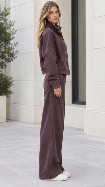 Side view of woman wearing Espresso two-piece casual tracksuit set