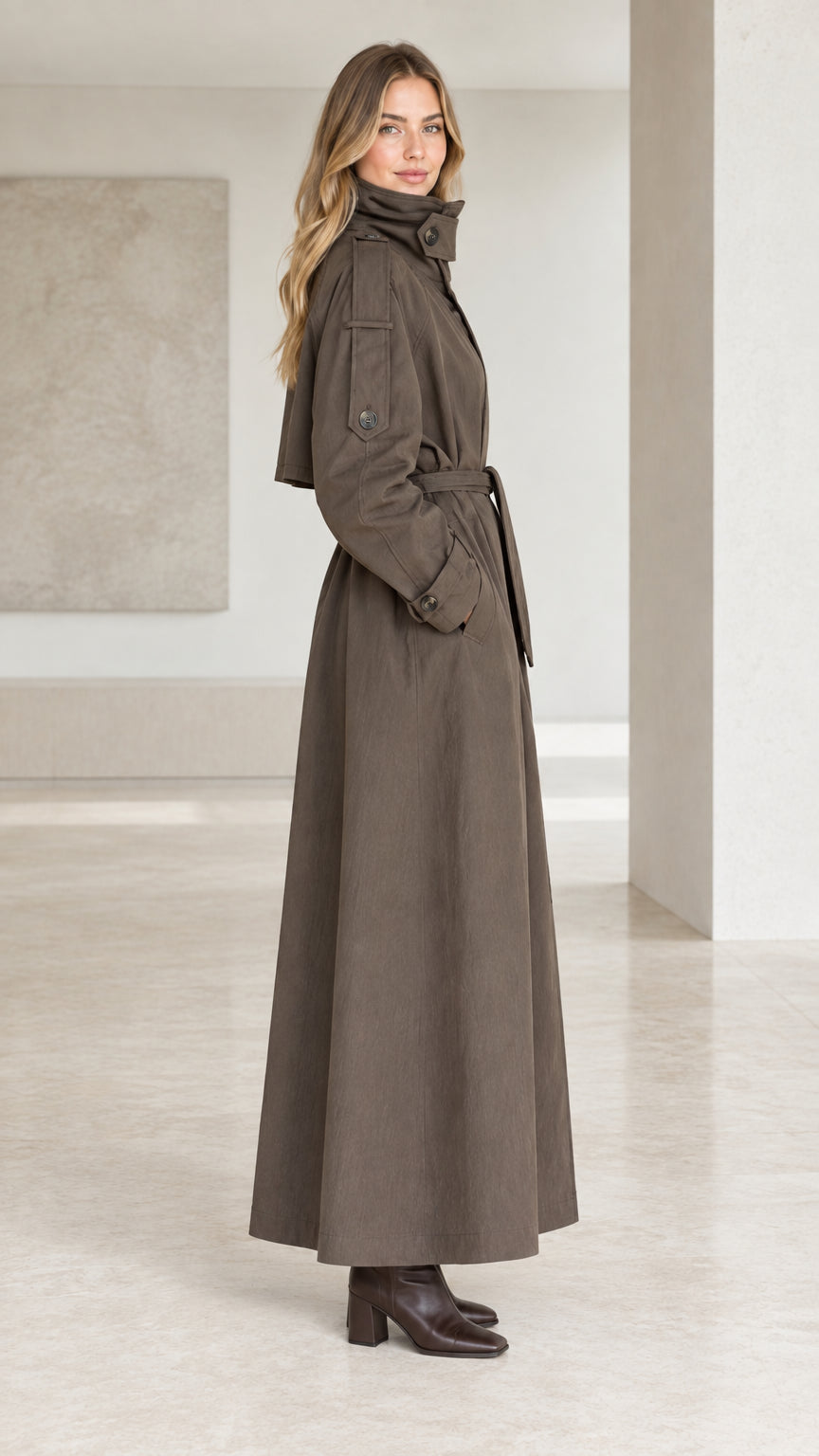 Side profile view of taupe longline duster trench coat
