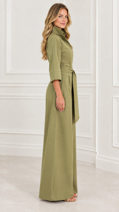 Side view of woman posing in an olive green wide-leg jumpsuit