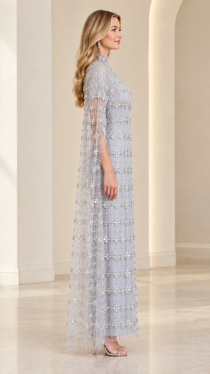 Side profile of Ice Blue embellished maxi dress showing cape sleeve drape