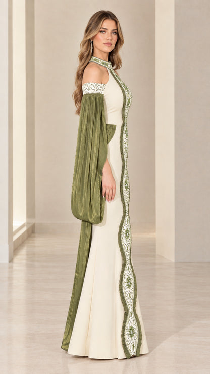 Side-angle view of ivory and olive formal dress showcasing pleated flowing sleeves