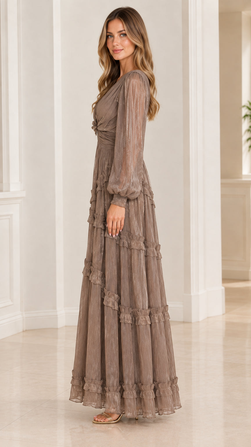 Side profile view of taupe plissé tiered maxi evening gown
