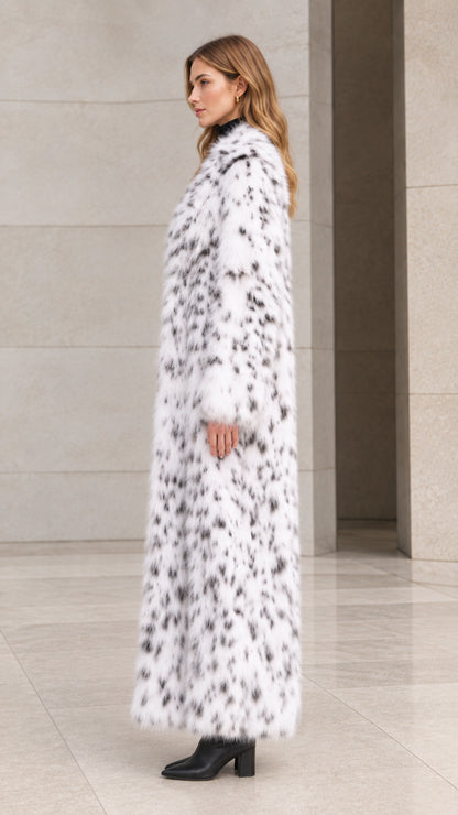 Side profile view of woman modeling long white speckled faux fur coat