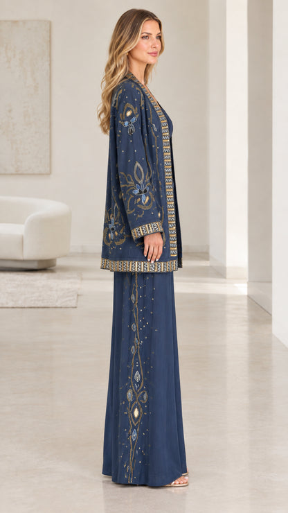 Side profile view of navy blue embroidered formal jacket and matching wide-leg trousers