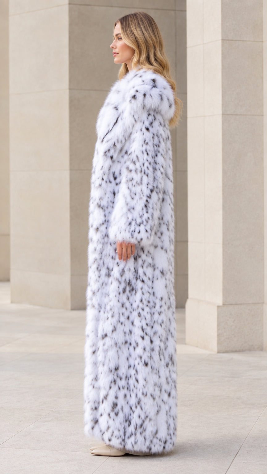 Side profile view of full-length snow white faux fur maxi coat