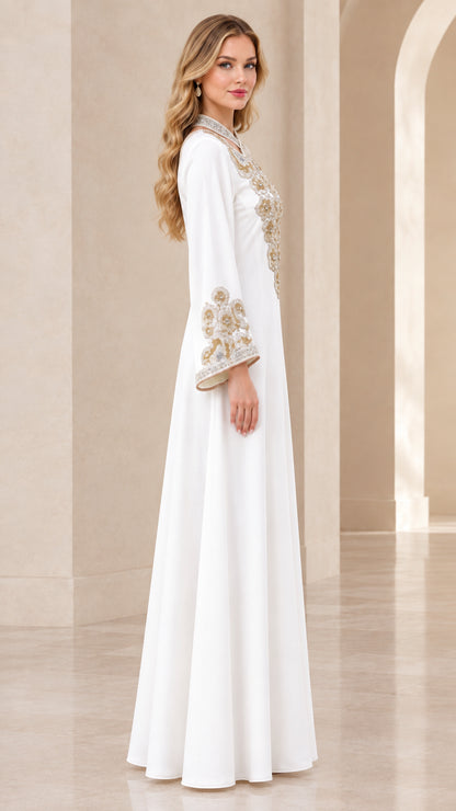 Side profile of elegant white long kaftan dress with metallic embroidered cuffs