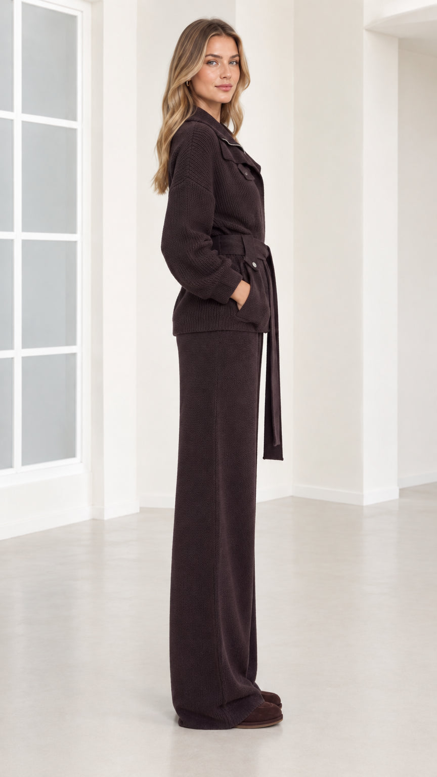 Side profile view of woman wearing dark brown matching knit two-piece set