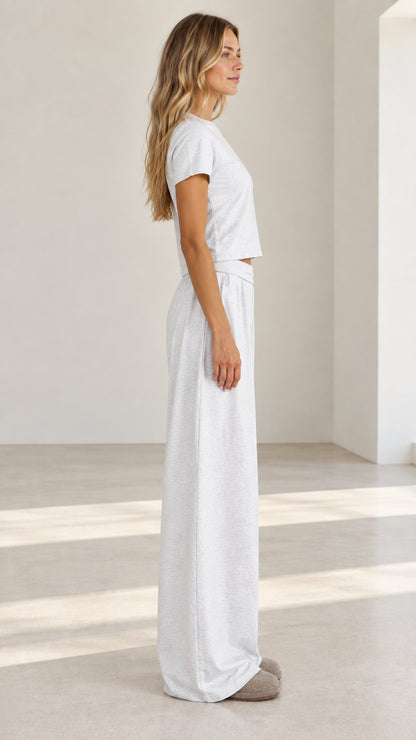 Side profile view of model wearing light grey matching two-piece loungewear set